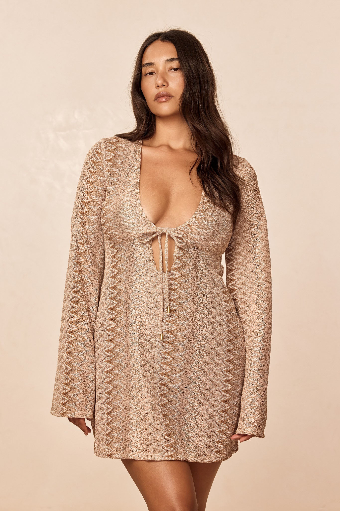 Front view of Montego Mini Tie Dress, Porto Cervo Gold, on model showing deep scoop neckline, tie-front, textured knit