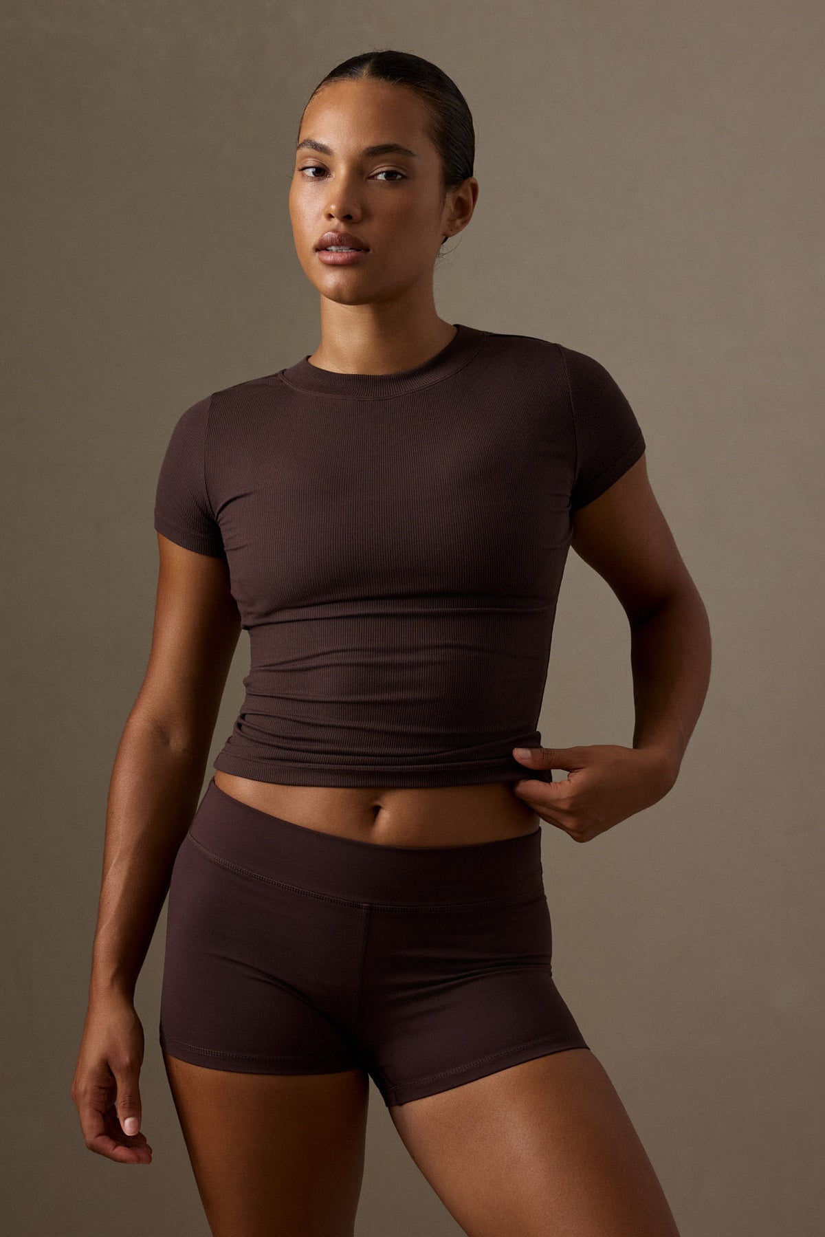 Front view of Ojai Tee Long in Espresso Light Weight Rib showcasing crew neck, short sleeves, and ribbed fabric on a model