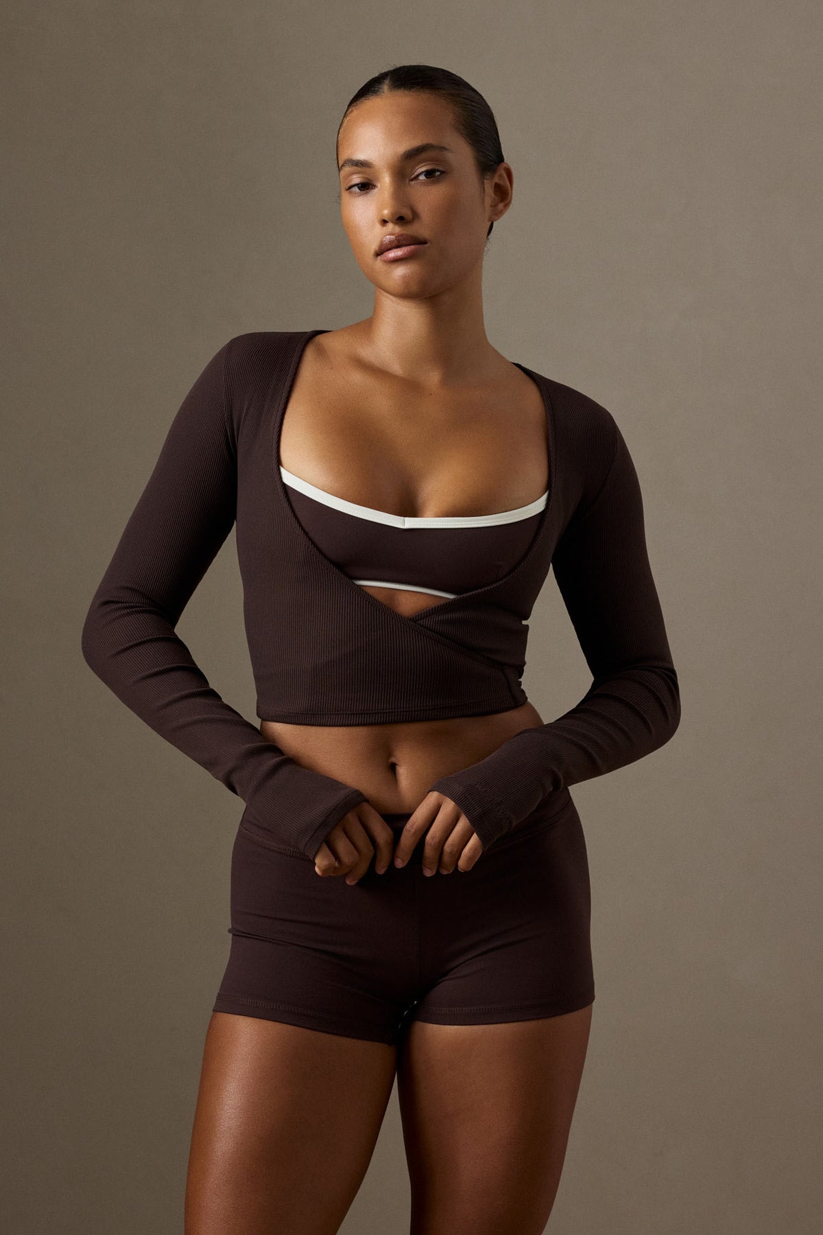Front view of Yosemite Top in espresso thin rib showcasing long sleeves and wrap front on a model against a neutral background