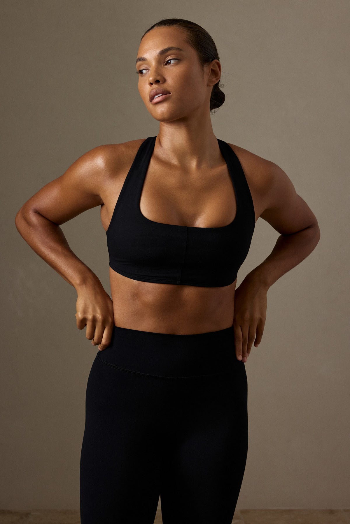 Front view of Central Park Bra in black showcasing center front seam with a neutral studio background