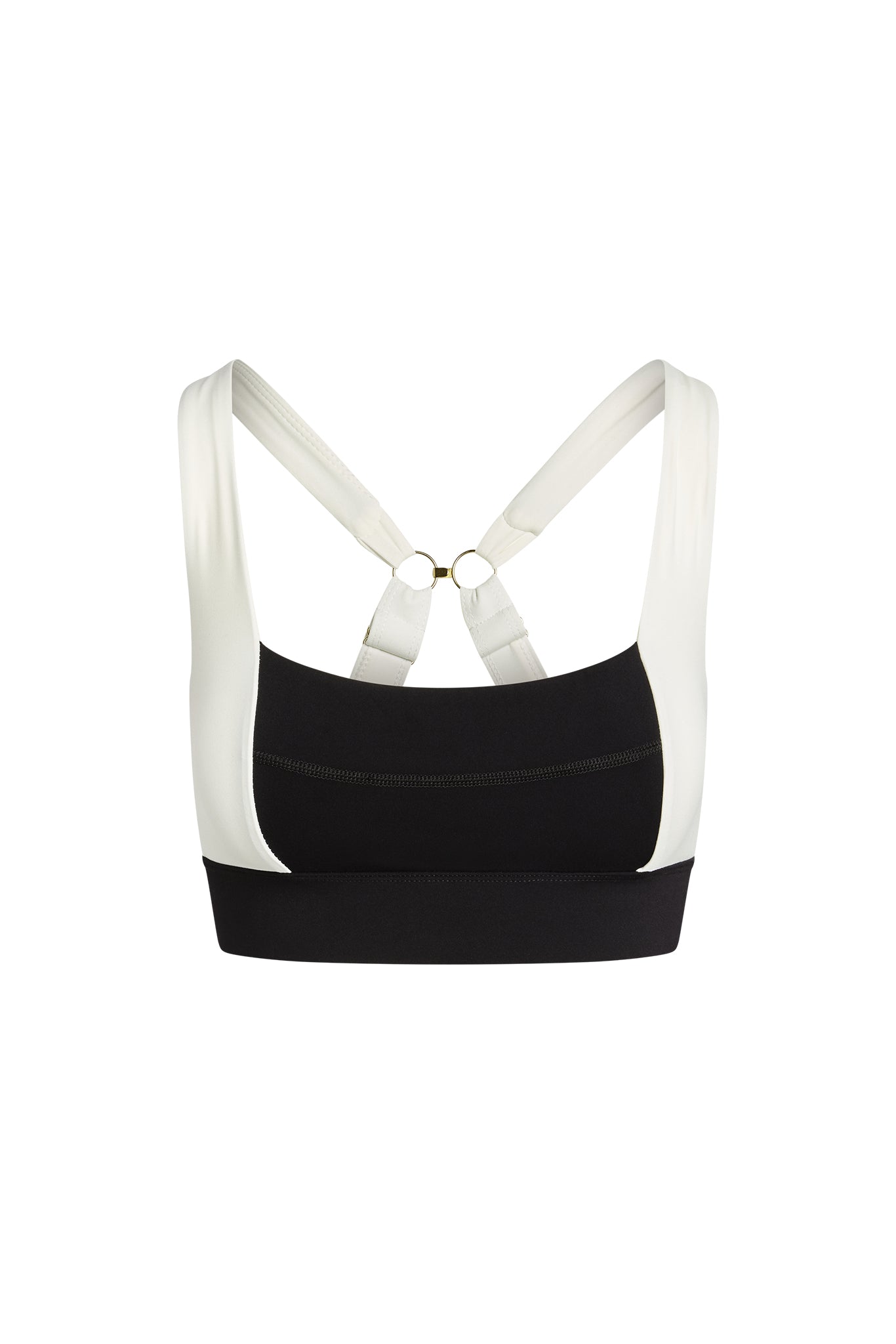Black and white sports bra with wide band, padded cups, and crisscross back straps with gold rings.