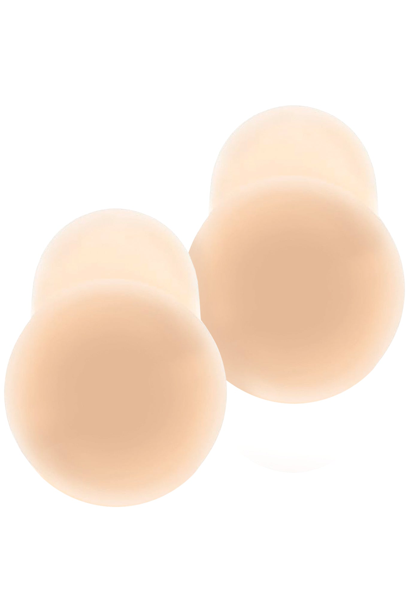 Pair of skin‑tone round adhesive nipple covers (pasties) overlapping slightly on white background.