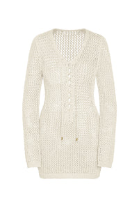 Front view of Corossol Mini Dress in ivory petit crochet showcasing lace-up neckline, gold details and long sleeves