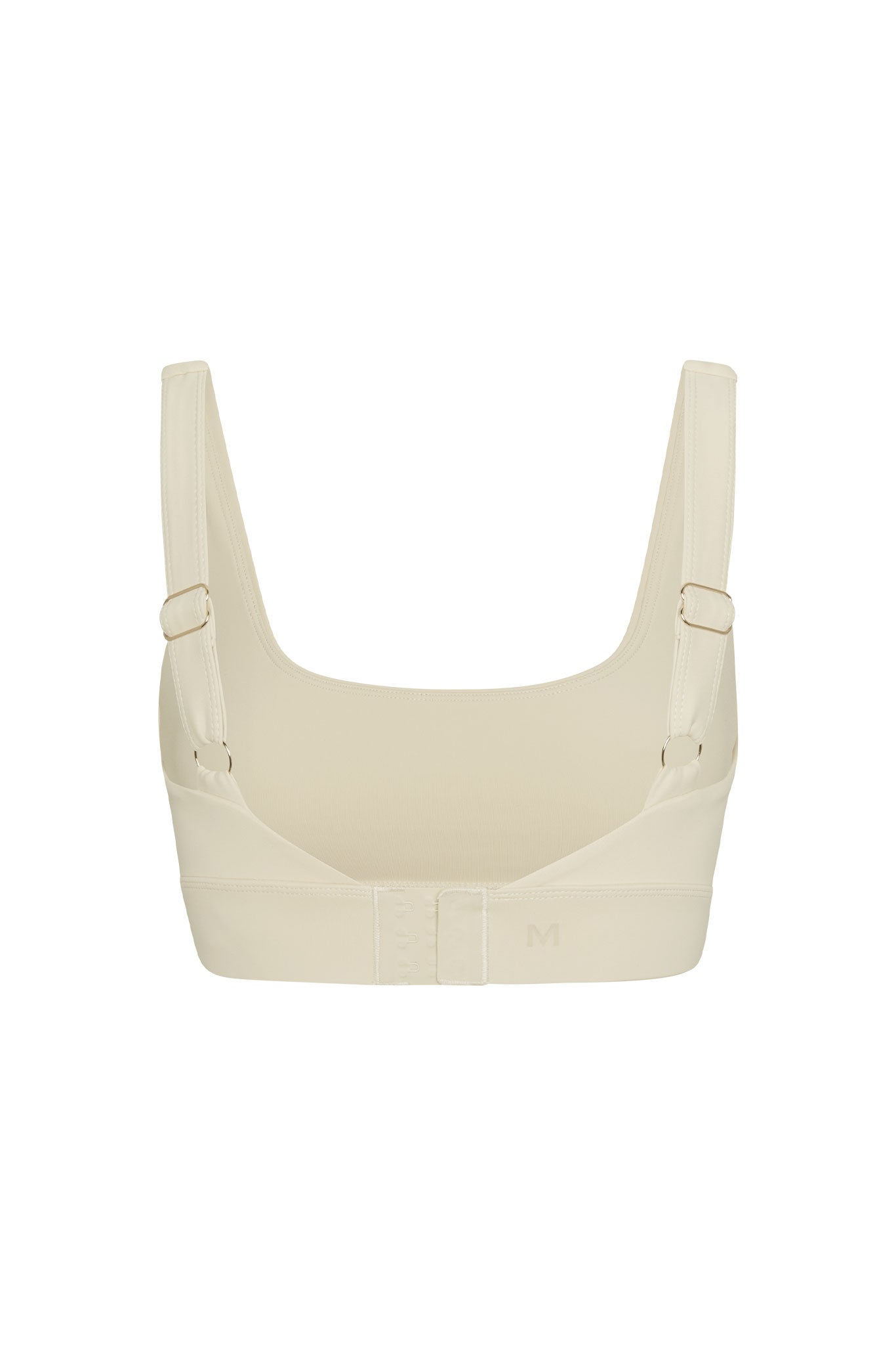 Cream wireless crop bra, back view showing adjustable straps and three-row hook-and-eye closure, M on band.