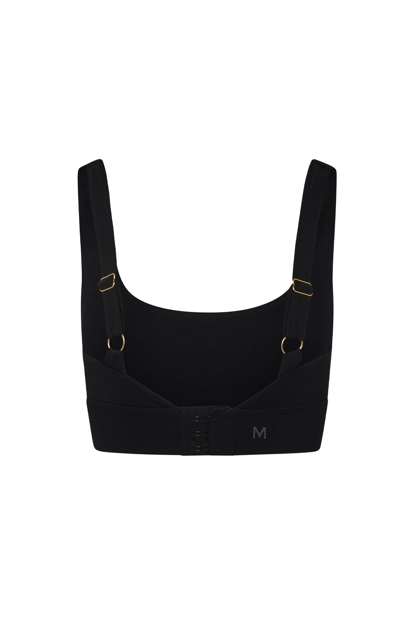 Back view of black supportive bra with adjustable straps, hook-and-eye closure and printed 'M' on band