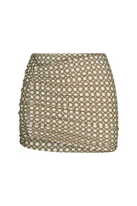 Front view of Bimini skirt in Tile Geo showing side ruched detail and brown-and-cream geometric tile print on white background