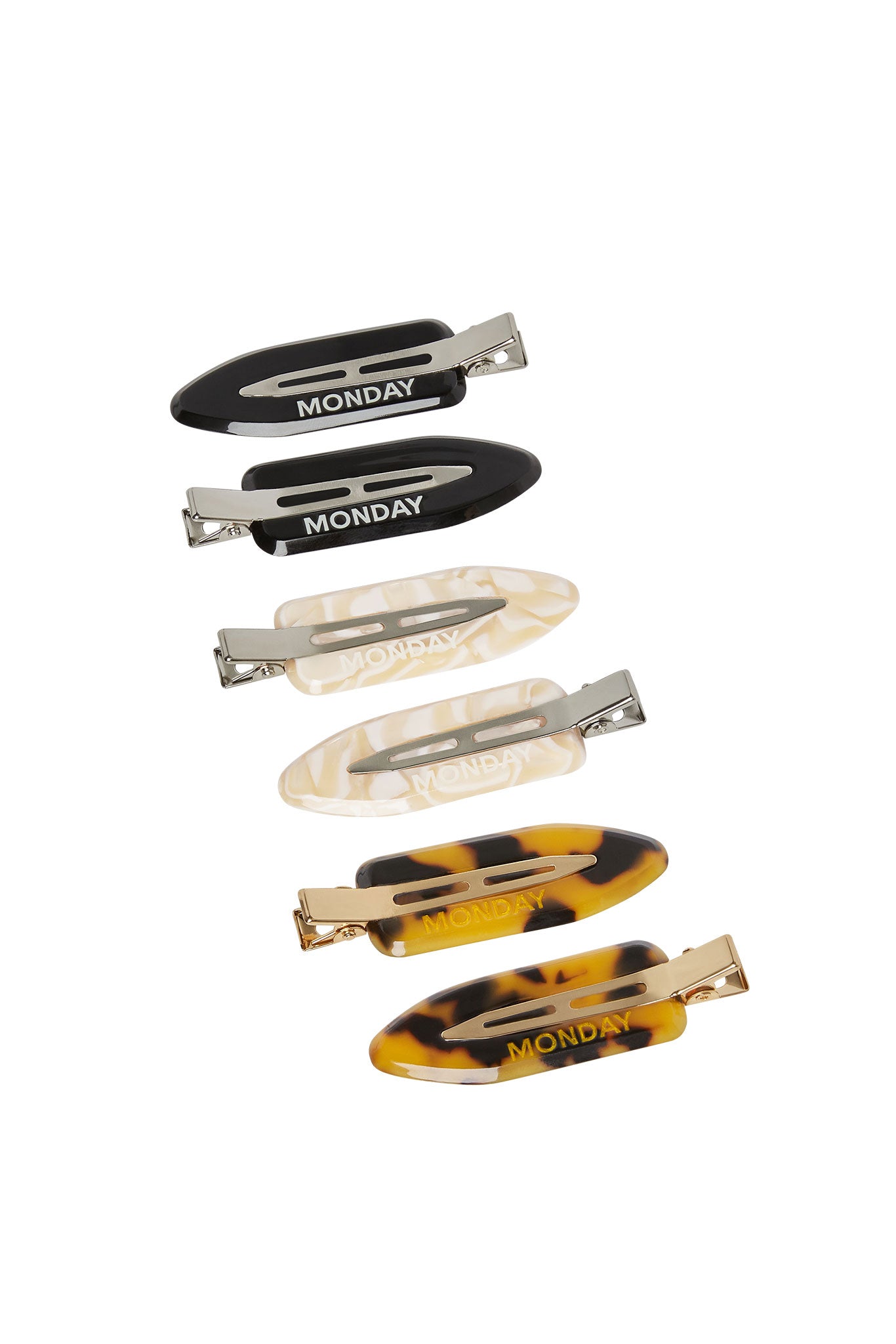 Set of six snap hair clips (black, cream, tortoiseshell), each printed with the word MONDAY.