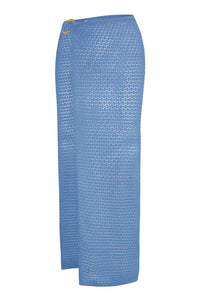 Blue ankle-length crochet knit wrap skirt with sheer textured pattern and gold ring buckle at the waist