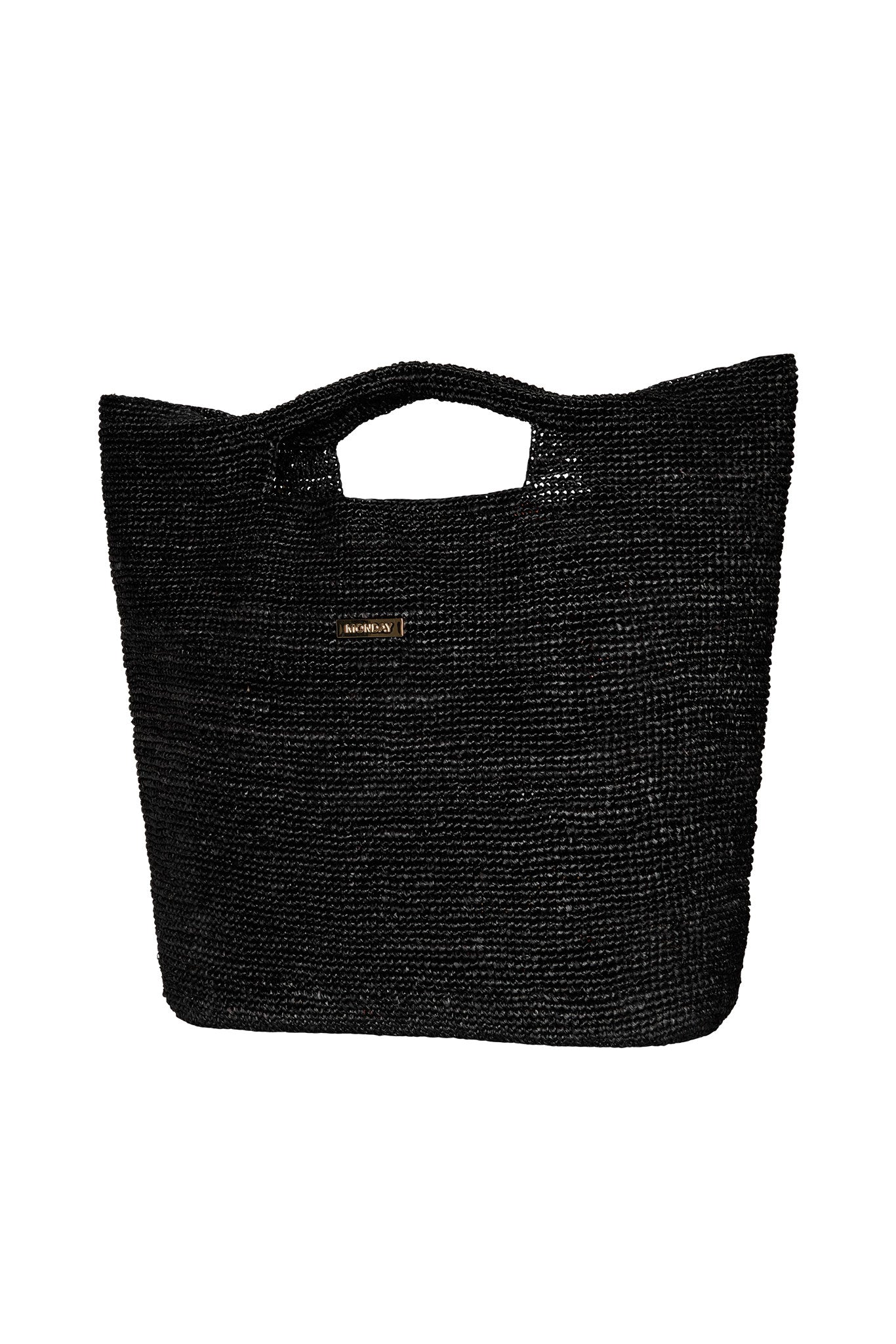 Black woven tote bag with built-in hand-cutout handles and small rectangular metal logo plaque.