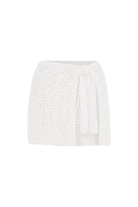 Front view of Santa Marta Sarong in white petit crochet, open knit wrap skirt with adjustable tie on white background
