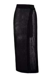 Side view of Sao Paulo sarong showcasing black lace crochet knit with ribbed tie waistband and open-knit side panel on white background