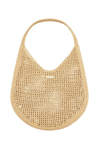 Front view of Shell Beach Bag in Natural showcasing open woven texture, wide shoulder strap and MONDAY logo tag on white background