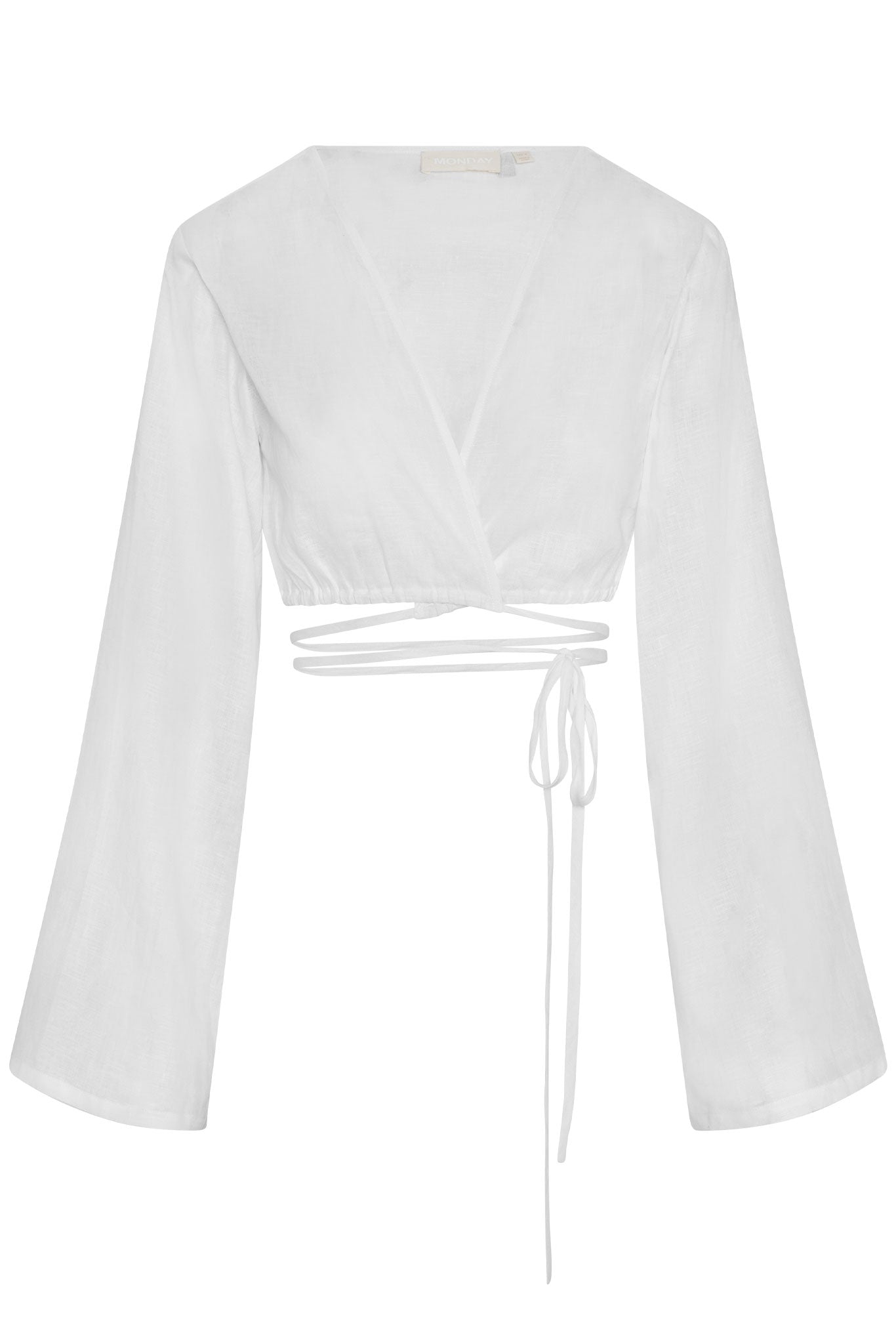 White linen wrap crop top with deep V, long bell sleeves and waist wrap ties; label reads MONDAY.