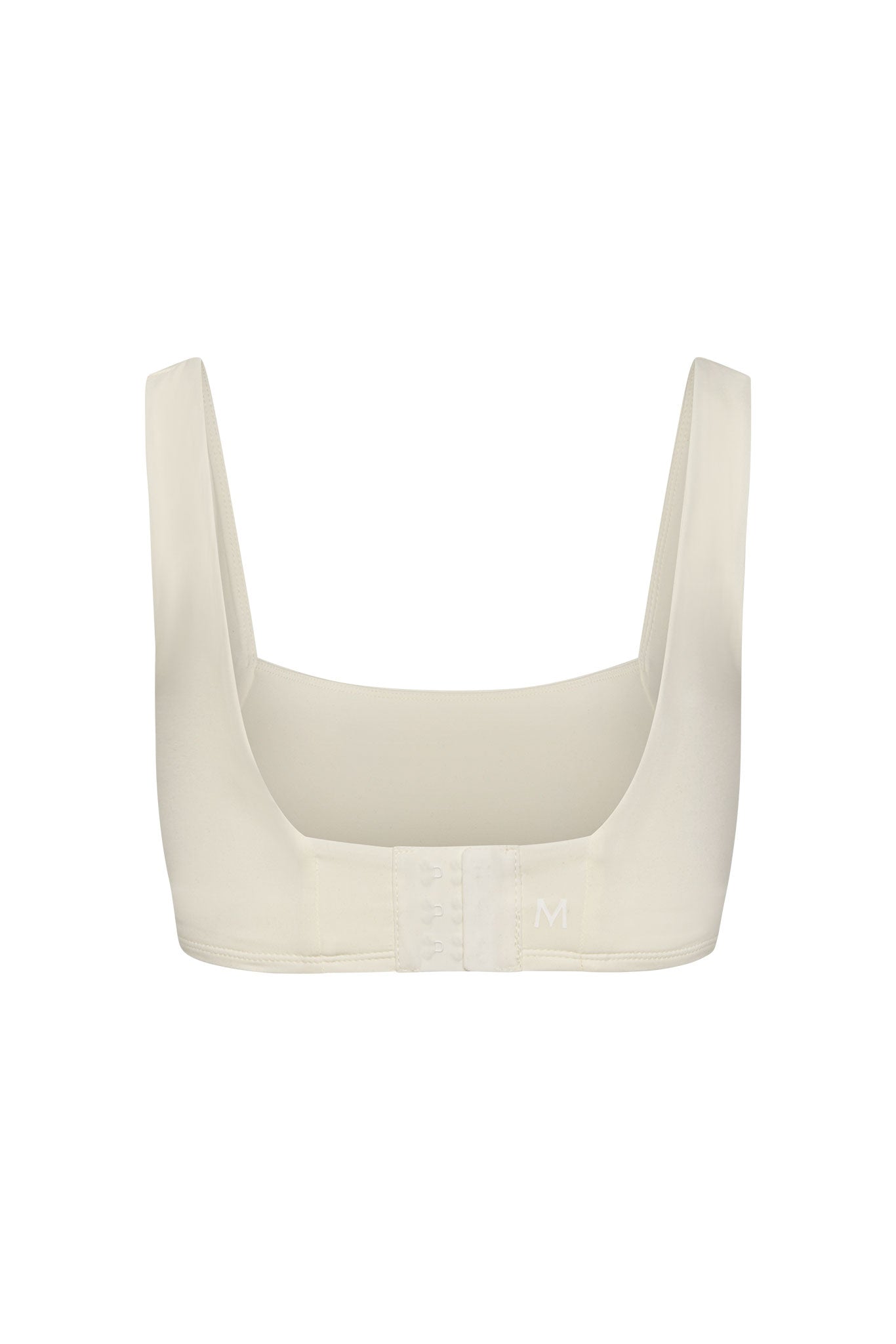 Cream scoop-back bra with wide straps and three-column hook-and-eye closure, size M visible