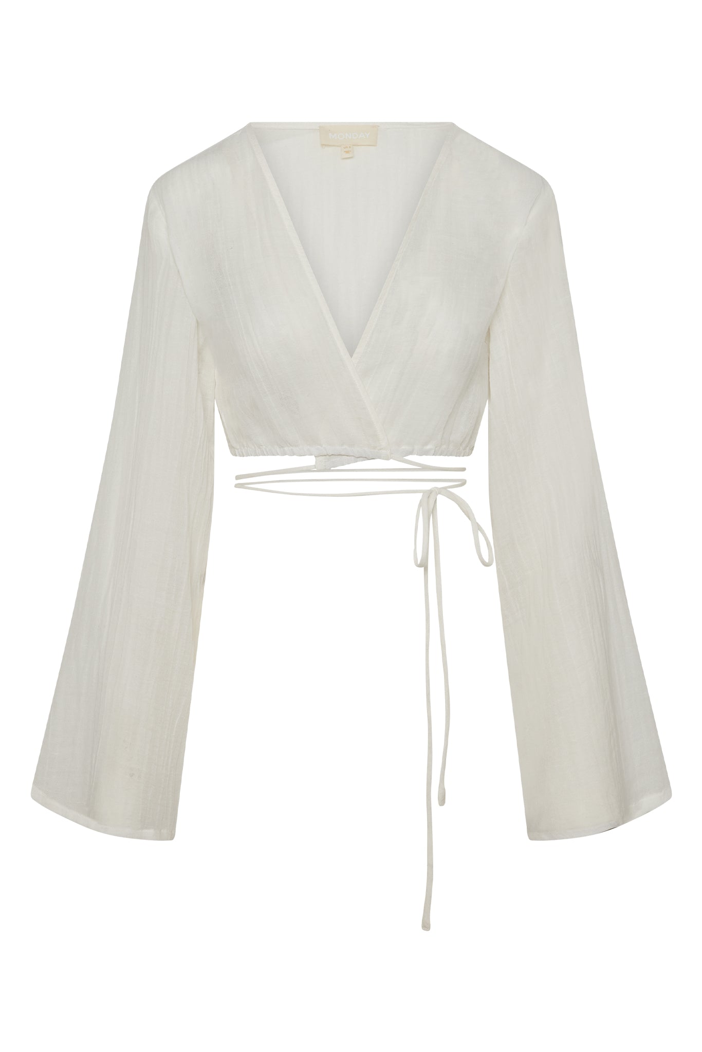 White cropped wrap blouse with deep V-neck, long bell sleeves, wrap-around ties, brand tag reading MONDAY