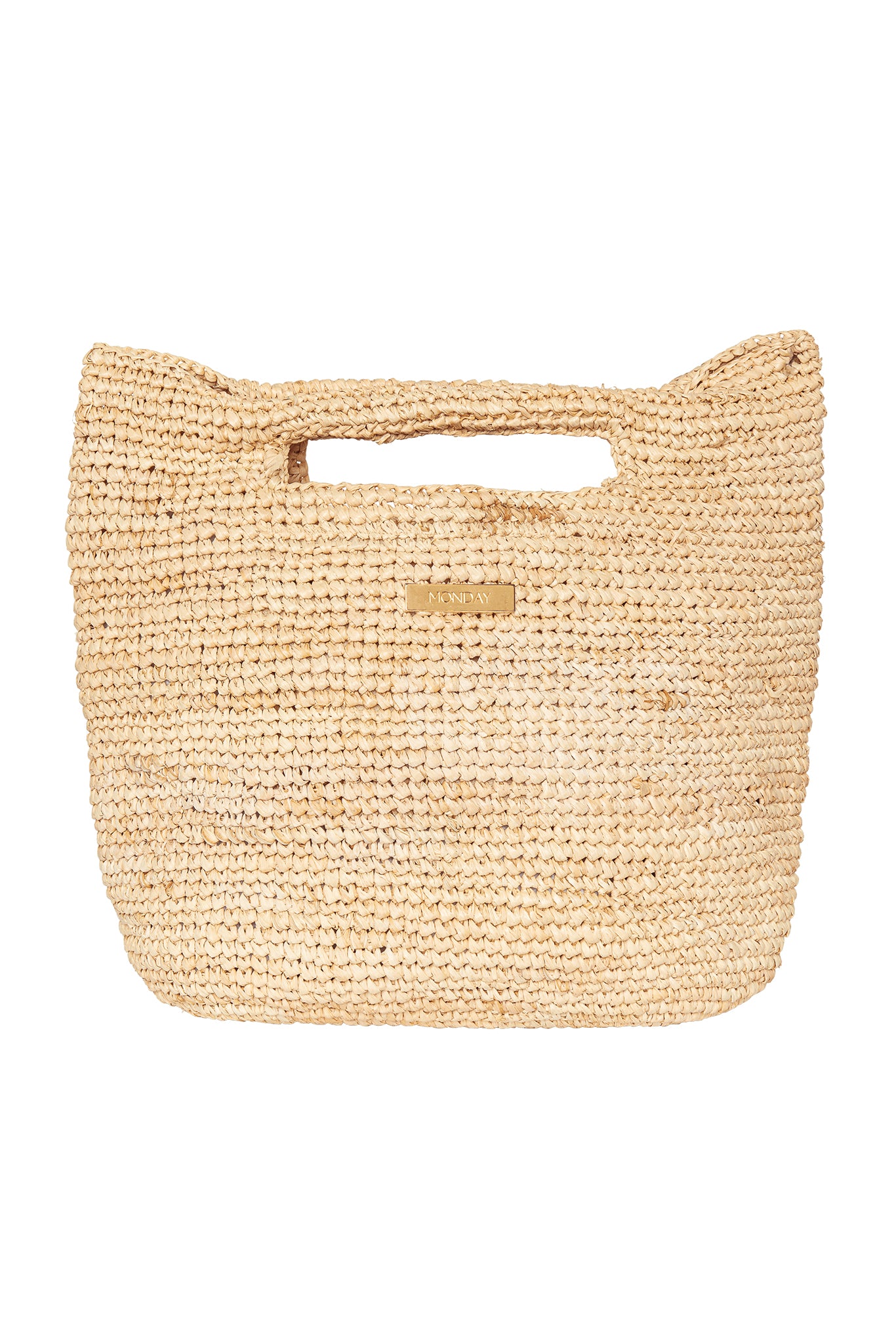 Woven natural straw tote with rectangular cutout handle and small metal tag reading MONDAY