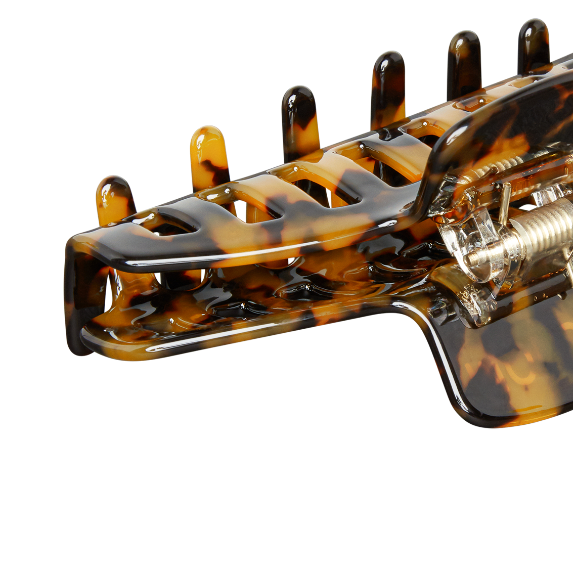 tortoiseshell patterned plastic hair claw clip showing teeth and metal spring hinge