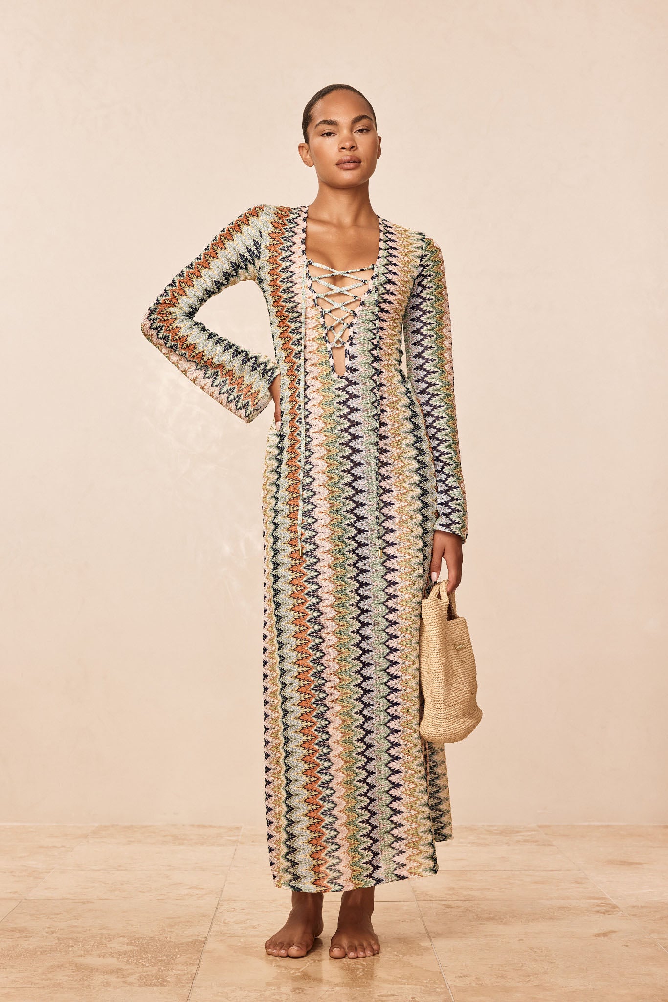 Front view of Corossol dress in Porto Cervo Multi with lace-up neckline, bell sleeves, and multicolor zigzag knit