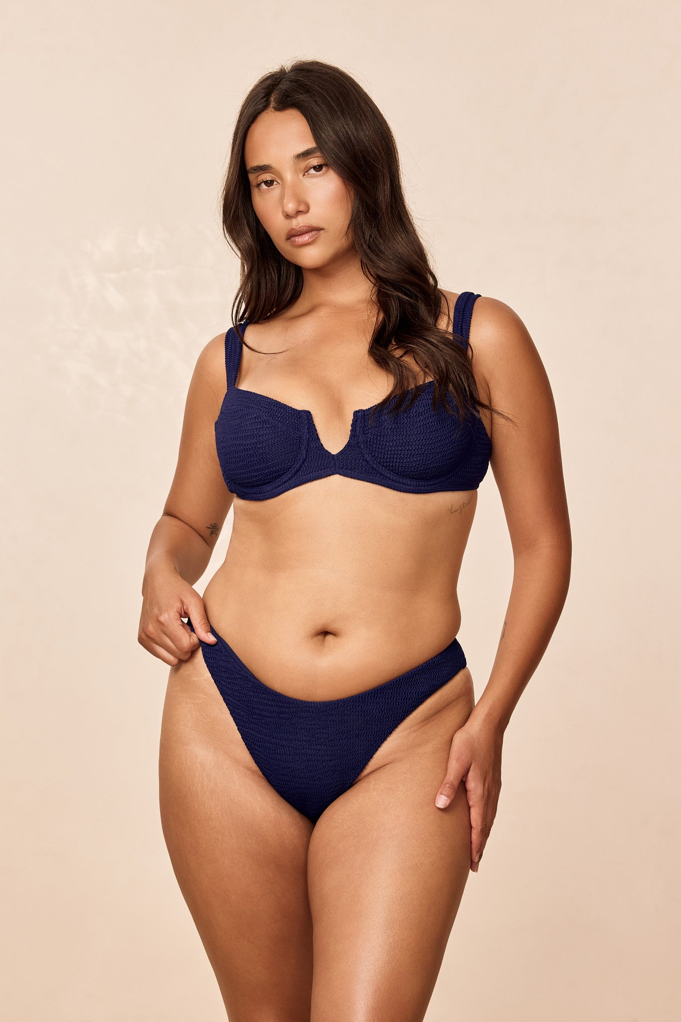 Front view of Byron Bottom in Midnight Crinkle on model showing high-cut leg and textured crinkle fabric against neutral background