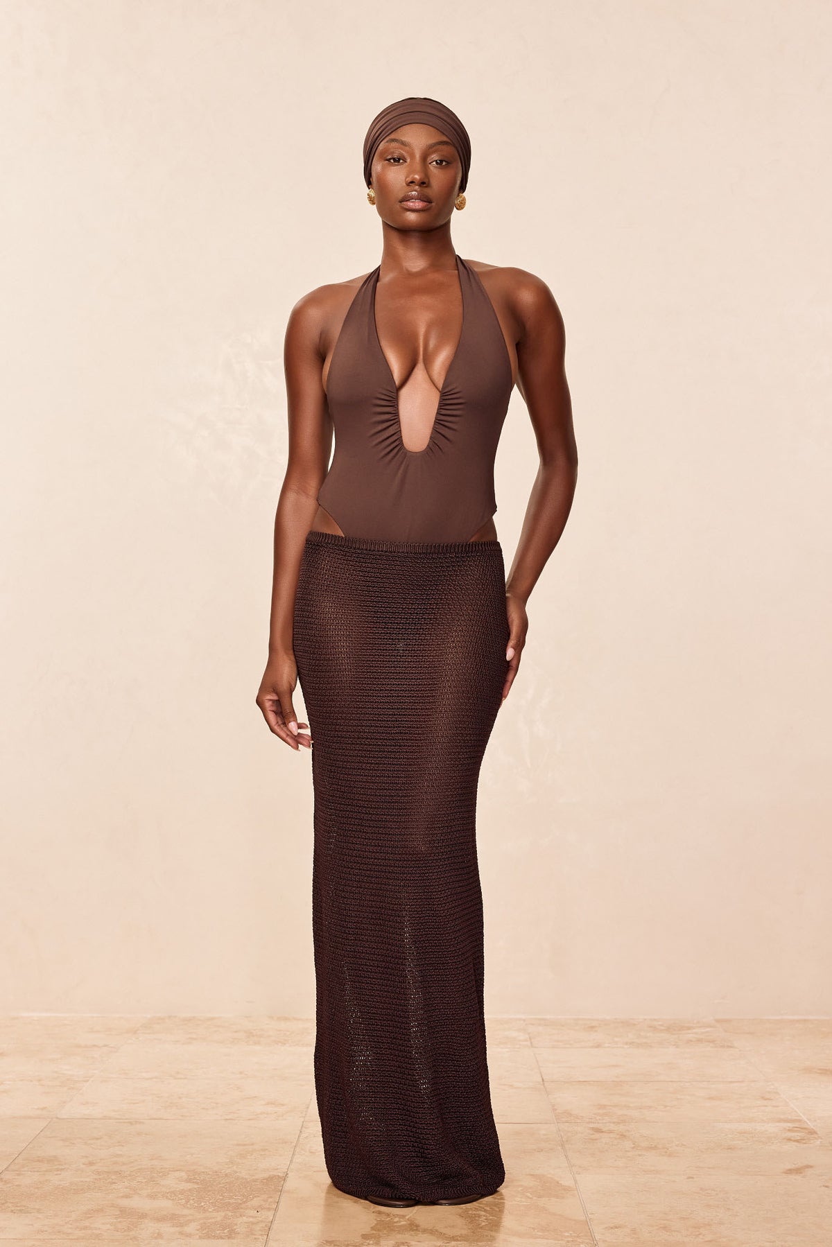 Front view of Fontelina Skirt in Espresso Treble Knit showcasing elastic waist and maxi length on a model indoors