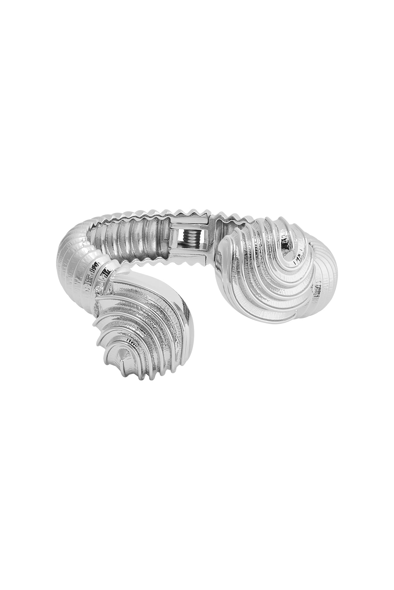 Silver ribbed cuff bracelet with shell-shaped ends and visible spring-hinge clasp