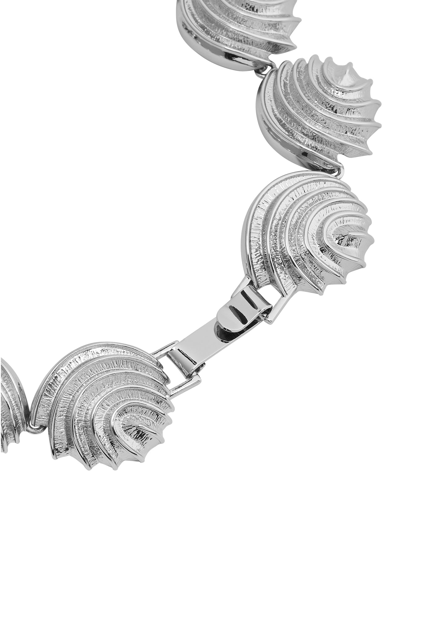 Silver-tone linked bracelet with ridged, shell-shaped segments and a fold-over clasp, shown on white background