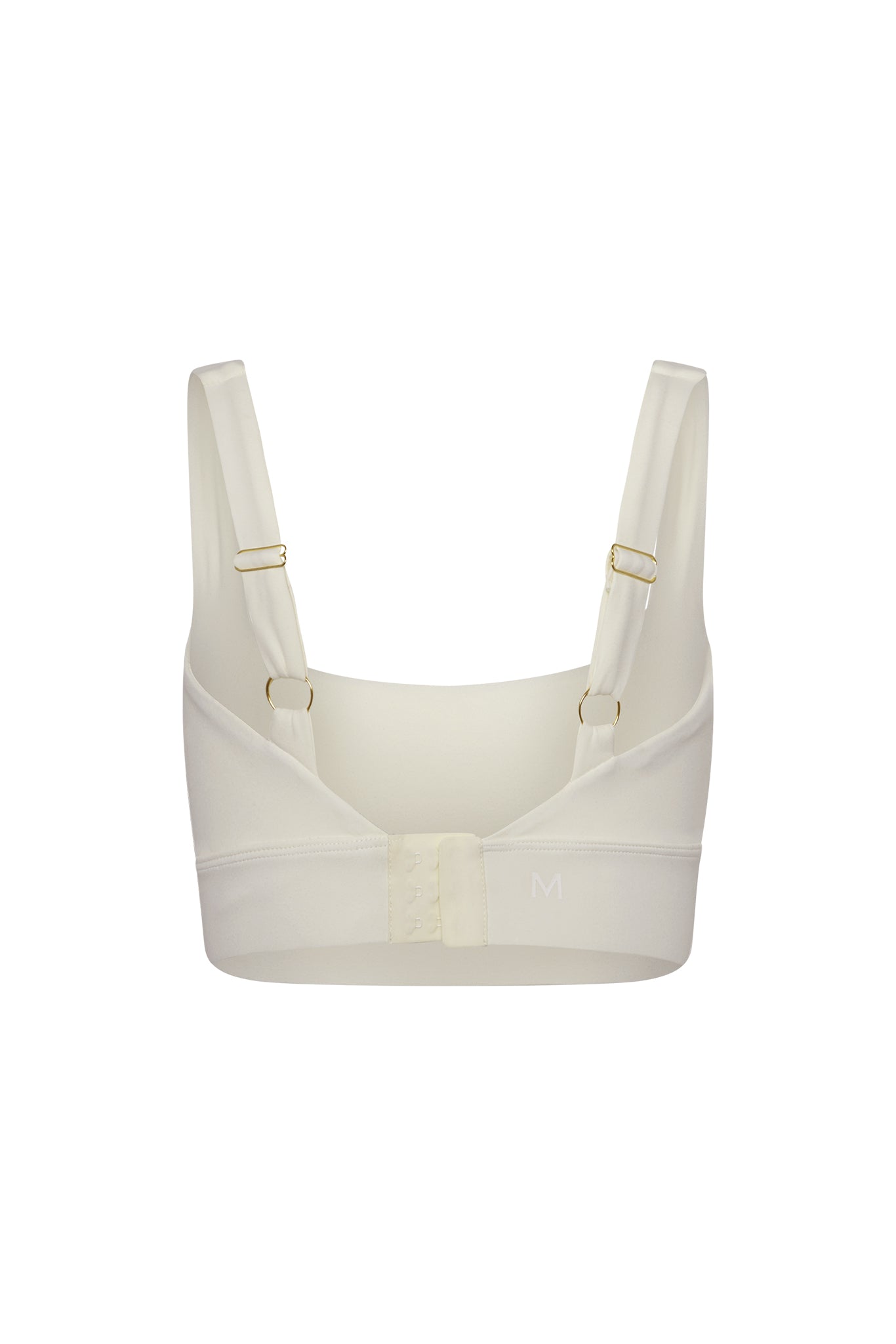 Cream wireless bra back view with adjustable straps, three-column hook-and-eye closure, size letter M on band.