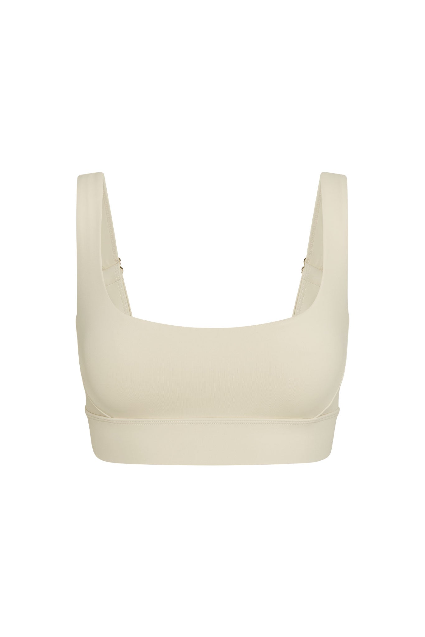 Cream seamless square-neck sports bra with wide straps and supportive underband.