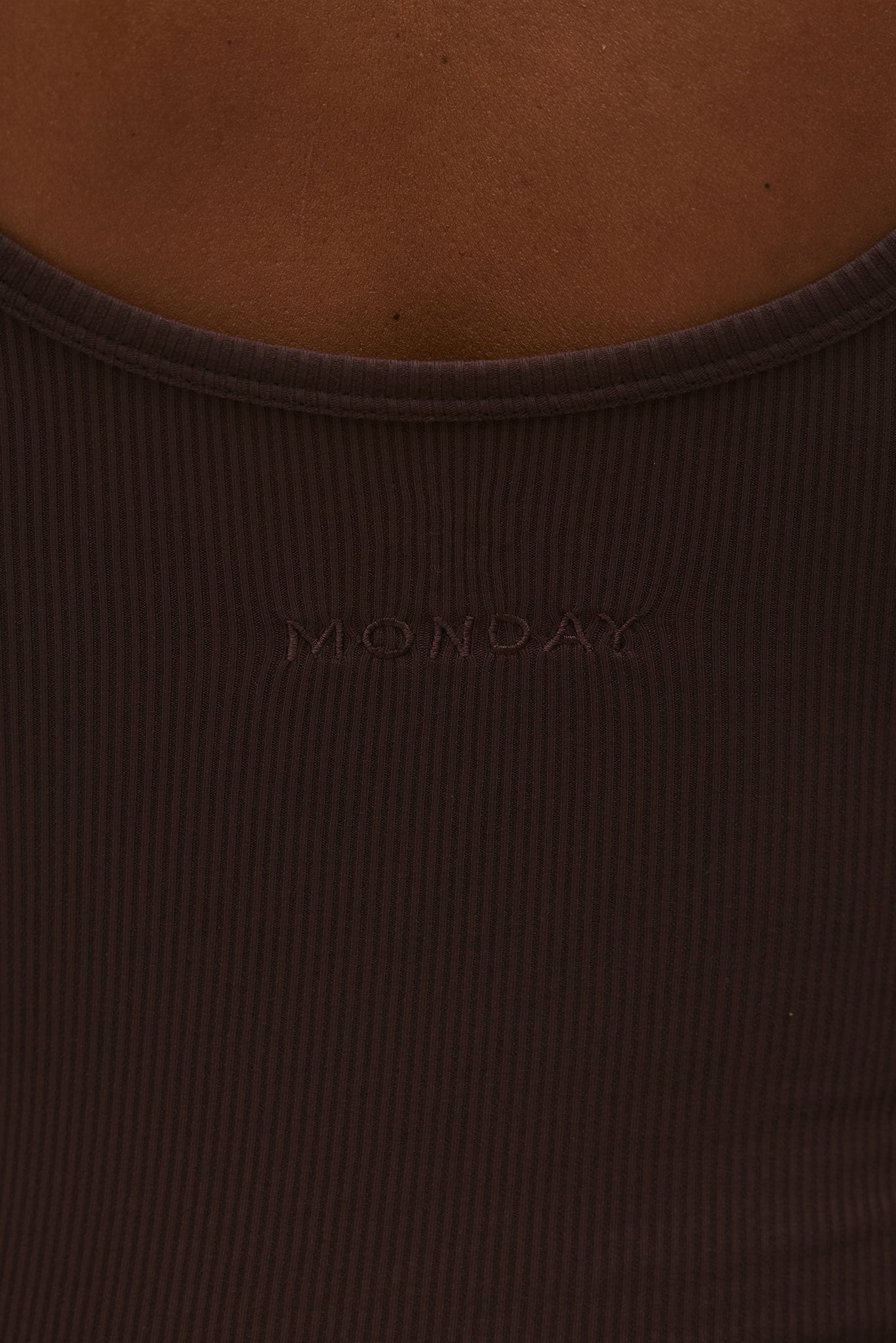 Ribbed brown tank top back with embroidered word MONDAY below the neckline