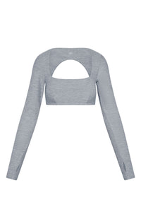 Light gray long-sleeve cropped top with square neckline and large semicircular front cutout; thumbhole openings at cuffs.