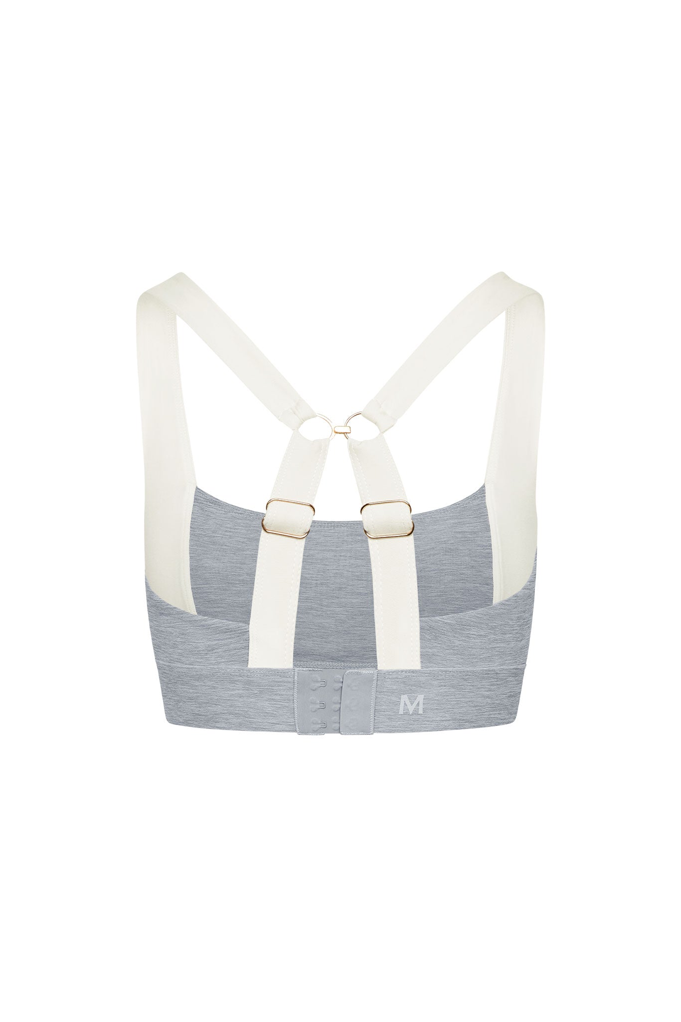 Back view of gray sports bra with cream cross-back straps, adjustable metal rings and three-row hook-and-eye closure, 'M' on band.