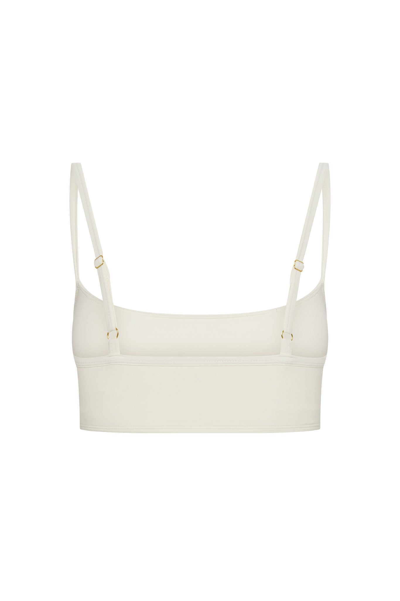 Ivory cropped bralette with adjustable thin straps and gold-tone hardware, back view.