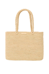 Front view of Valencia Bag Large showcasing woven raffia texture, braided handles, and gold MONDAY plaque with white background