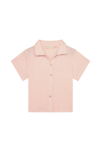 Front flat lay of Pacific Beach Shirt Kids showcasing powder pink crinkle texture, short sleeves and button-front on white background