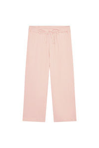 Flat lay of Tuscany Pant Kids powder pink crinkle showing smocked waistband, drawstring tie, and wide flare legs on white