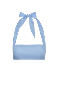 Front view of Montserrat Top in Sky Linen showcasing cropped linen bandeau with halter tie bow on white background