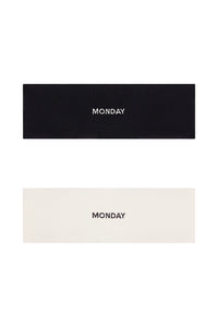 Flat lay of Monday Headband set (black and ivory) showing centered embroidered MONDAY on each headband on white background