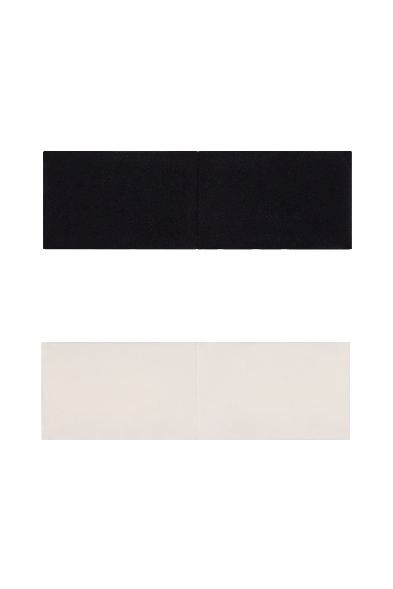 Two strapless bandeau bras laid flat on white background, one black above one cream; each has a vertical center seam.