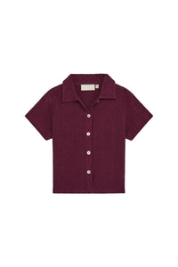 Front view of Pacific Beach Shirt Kids showcasing fig crinkle fabric, short sleeves and camp collar on white background
