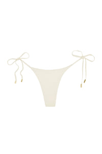 Front view of Palma Thong in ivory showcasing adjustable side ties and gold hardware on a white background