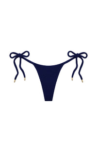 Front view of Palma Thong in Midnight Crinkle showing adjustable side ties, gold hardware, and minimal coverage on white background