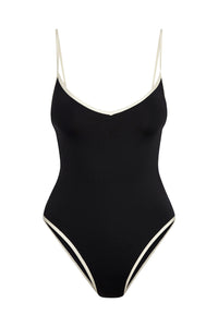 Front view of Ravello One Piece in black with ivory trim showcasing wide V neckline and thin shoulder straps on white background