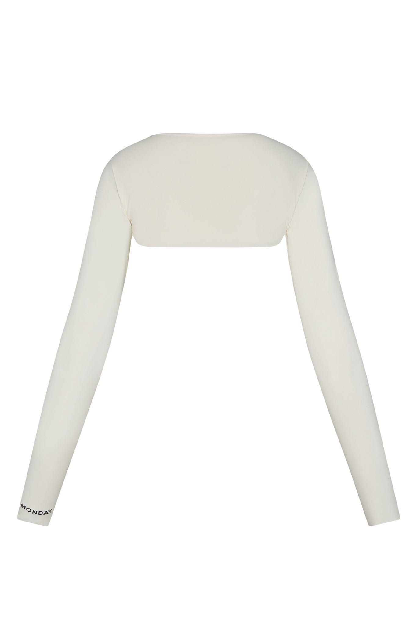 Ivory cropped shrug with long fitted sleeves; MONDAY printed near left cuff