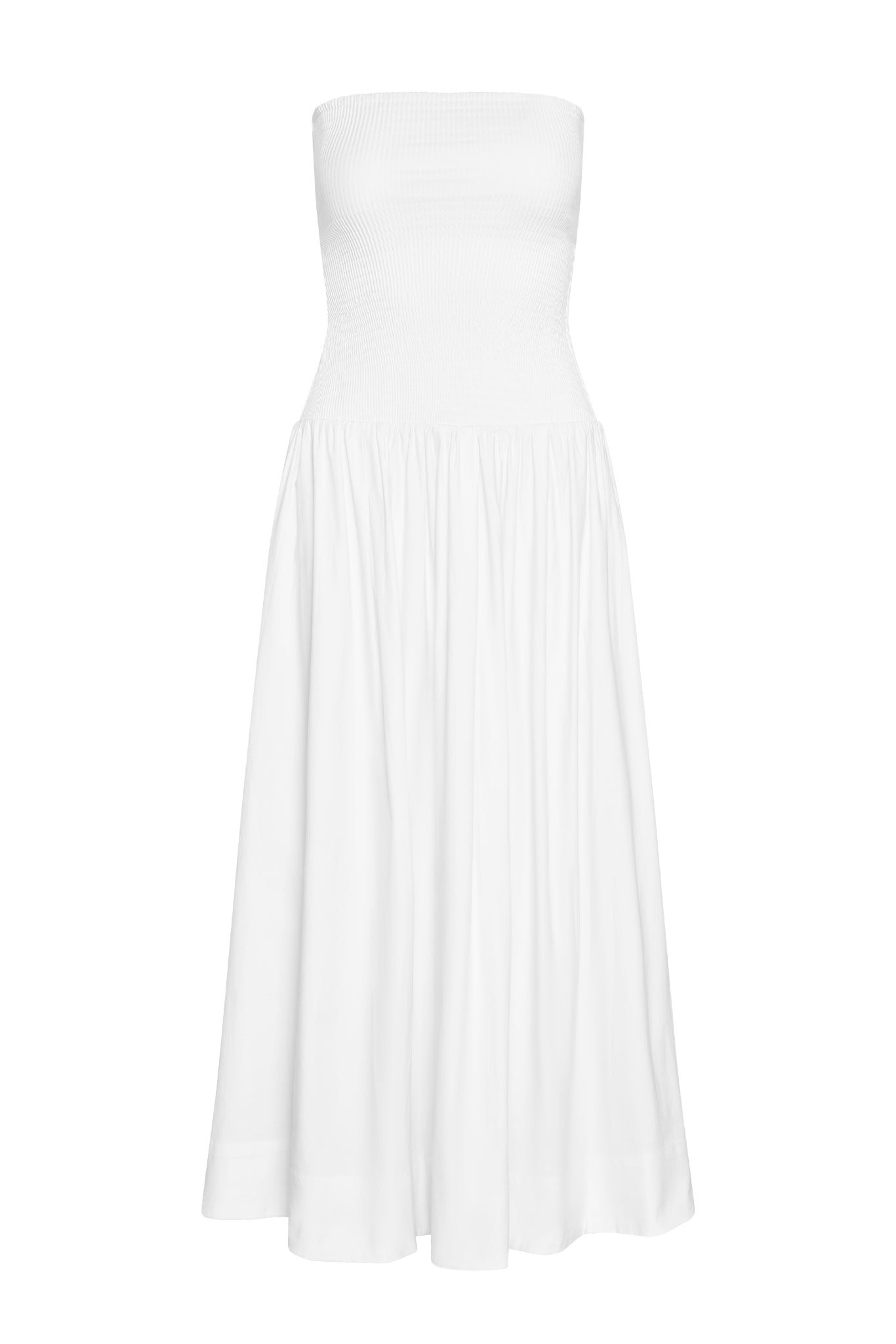 White strapless maxi dress with smocked bodice and gathered full skirt on plain background.