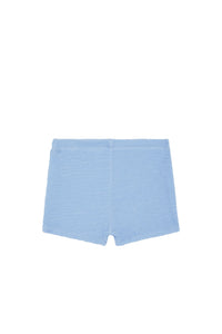 Flat lay of Santa Cruz Short Kids in Sky Crinkle showcasing textured crinkle fabric and elastic waistband on white background