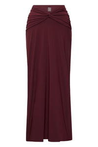 Front view of St. Croix Maxi Skirt in Deep Burgundy showcasing twist front drape waist detail on white background