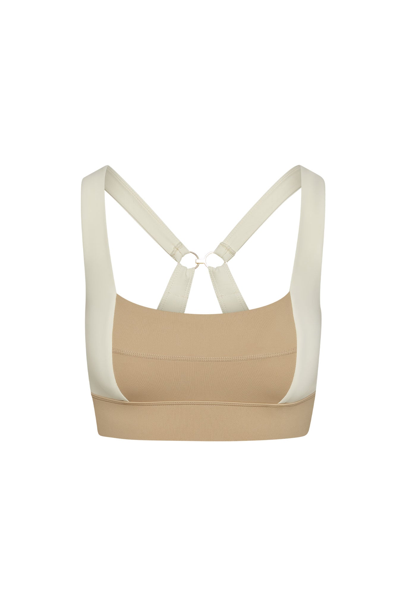 Beige and cream color-blocked sports bra with crisscross back straps and gold ring detail