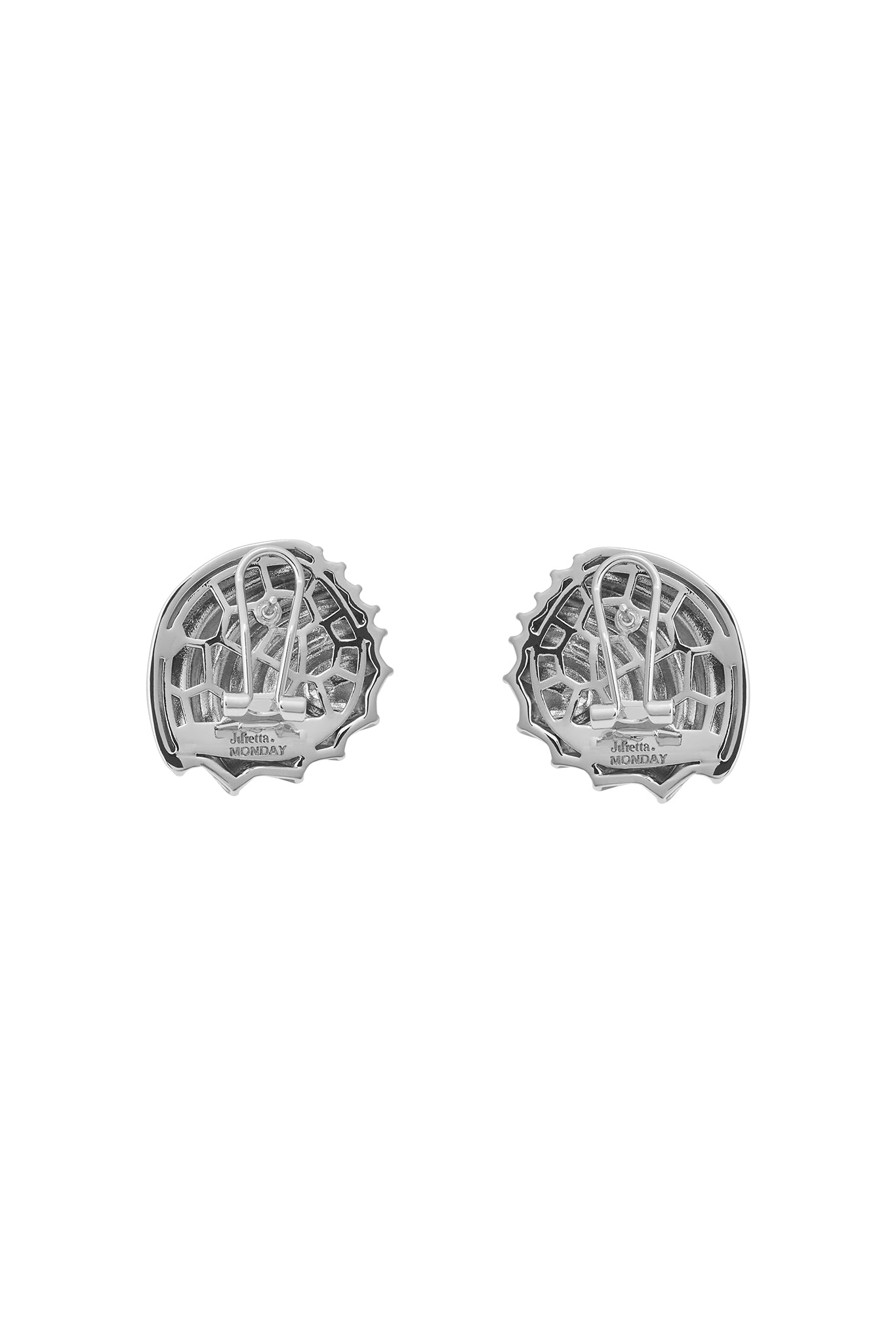 Pair of silver clip-on earring backs with honeycomb pattern and stamped text 'Julietta MONDAY'