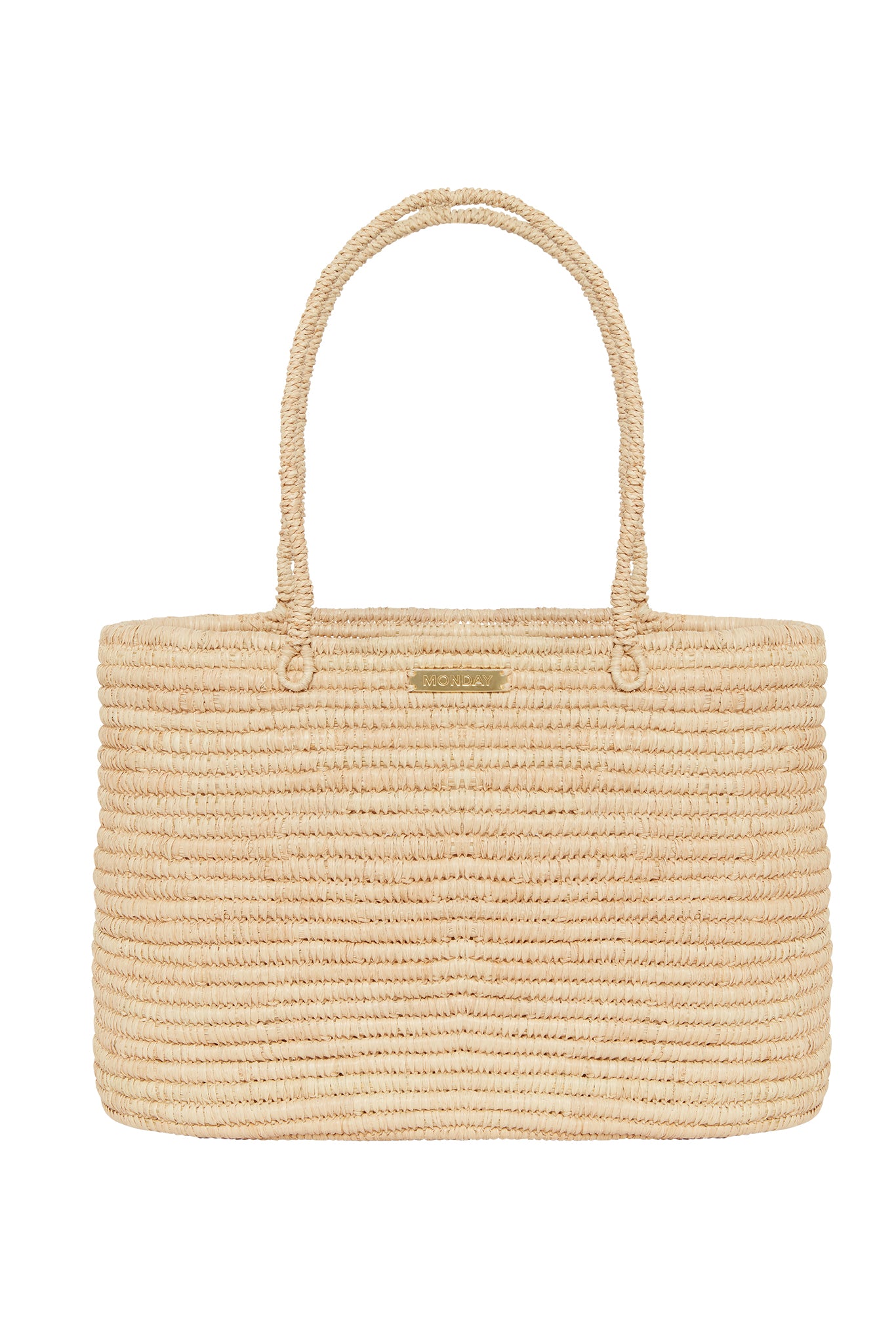 Beige woven straw tote bag with shoulder handles and small metal plaque reading MONDAY