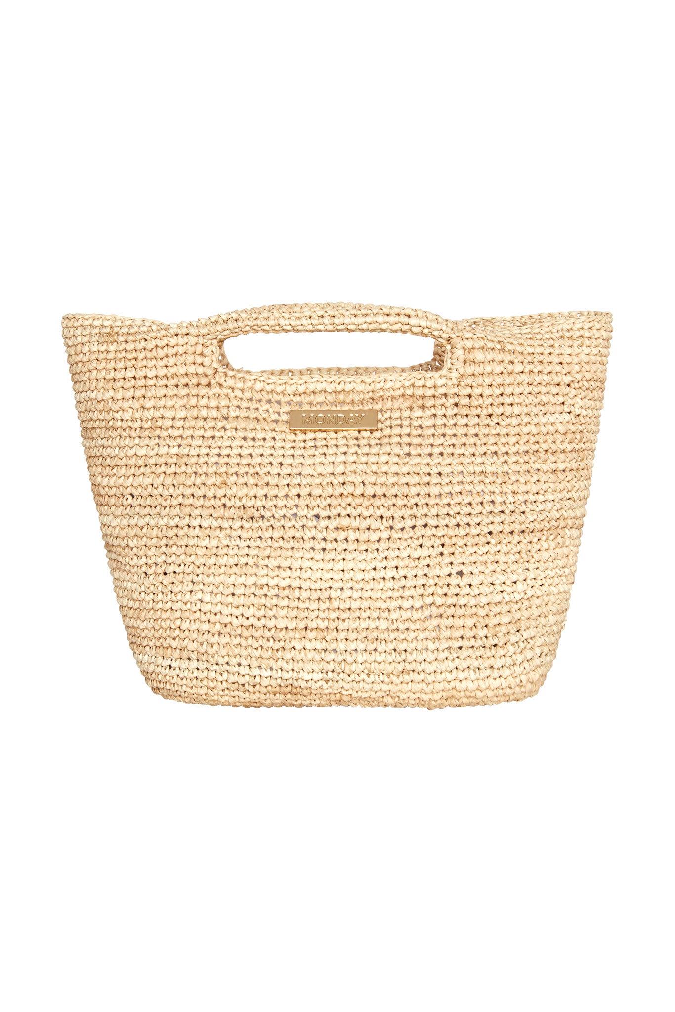 Beige woven straw tote with cutout handles and a small metal plate reading MONDAY.